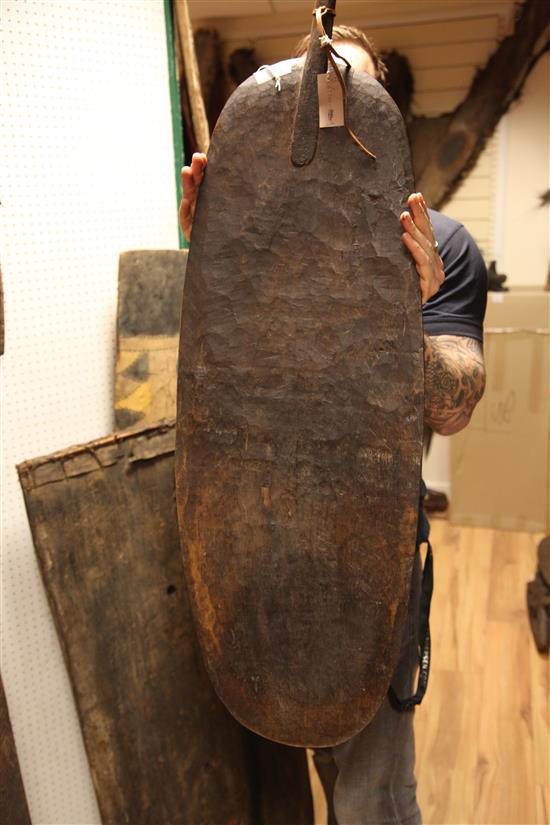 Four Sepik River wooden tribal shields, variously carved